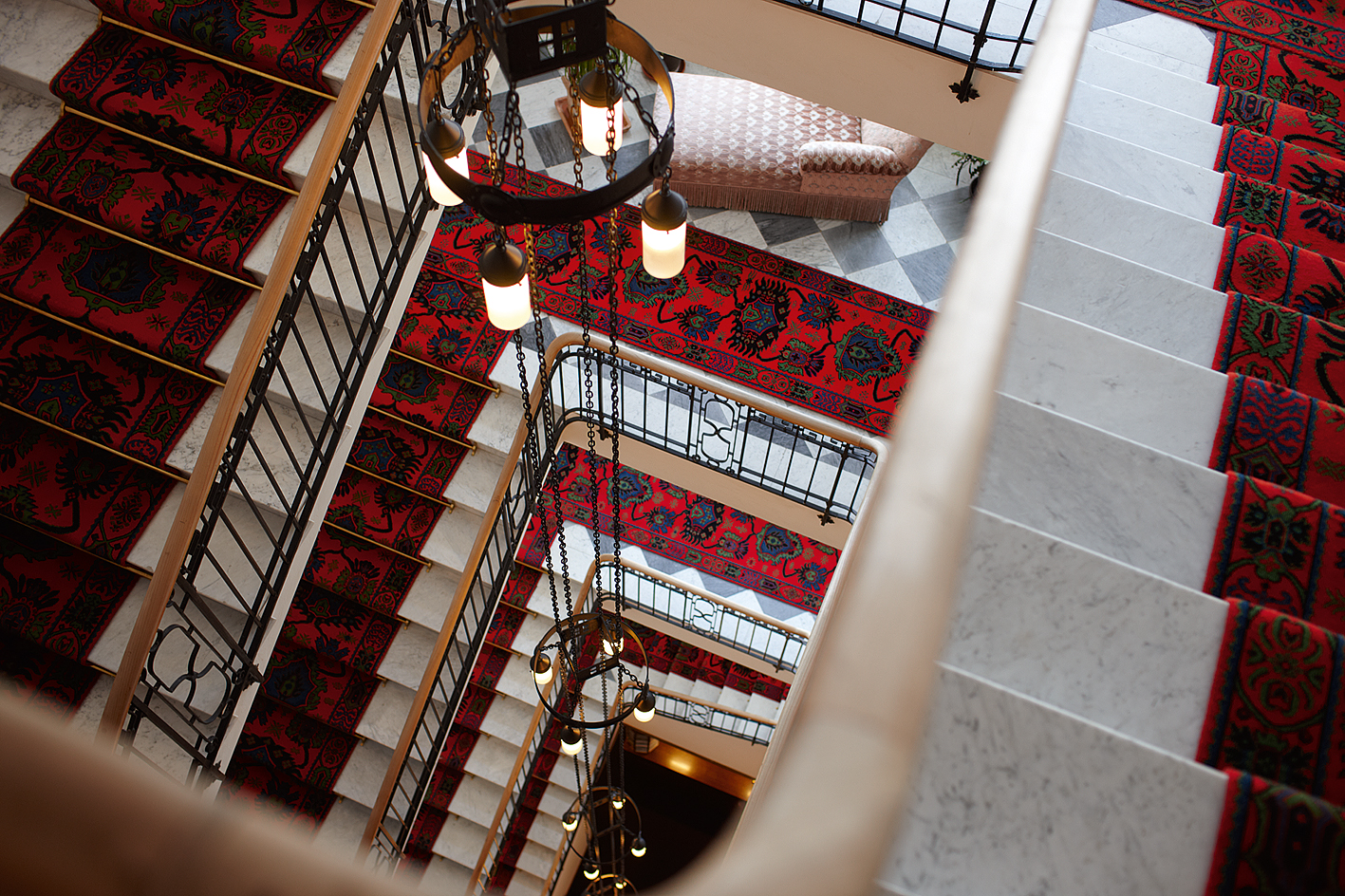 spiral staircase with red carpet